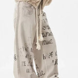 Jeans dritti in denim con graffiti color albicocca