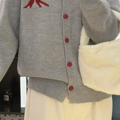 Cardigan rotondo in jacquard con fiocco morbido