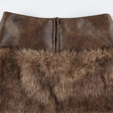 Minigonna a vita bassa con pannelli in pelle sfocata