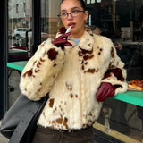 Cappotto caldo e soffice in pelliccia sintetica con stampa leopardata