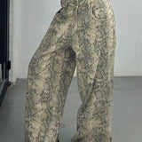 Jeans sfilacciati a vita bassa con gamba larga e stampa serpente