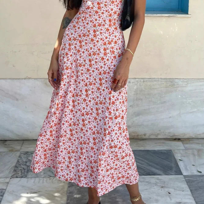 Abito con scollo a V e stampa floreale, dettagli a contrasto e lacci sulla schiena