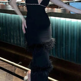 Abito a canotta con strati di pelliccia e strass