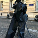 Soprabito in pelle PU nera con spacchi alti