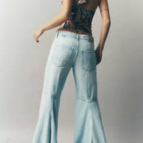 Jeans eleganti a vita alta e a zampa d'elefante lunghi fino al pavimento