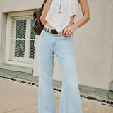 Jeans eleganti a vita alta e a zampa d'elefante lunghi fino al pavimento