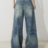 Jeans larghi a vita alta con gamba a falce