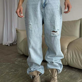 Jeans larghi a vita alta con gamba a falce