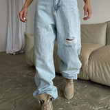 Jeans larghi a vita alta con gamba a falce