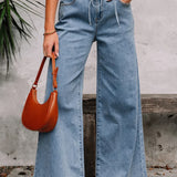 Jeans svasati a vita alta con tasche