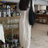 Abito lungo slim in maglia effetto consumato