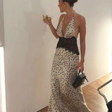 Abito lungo con sottoveste a pois e occhielli in pizzo