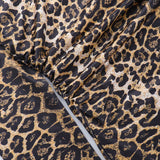 Miniabito con scollo a V e nodo incrociato con stampa leopardata