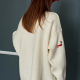 Cardigan largo con bottoni ricamati in maglia con bassotto