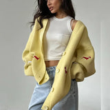 Cardigan largo con bottoni ricamati in maglia con bassotto