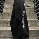 Jeans larghi a vita bassa con ricamo e gamba dritta