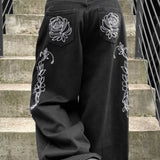 Jeans larghi a vita bassa con ricamo e gamba dritta