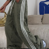 Jeans larghi a vita bassa e a righe