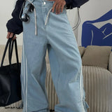 Jeans larghi a vita bassa e a righe