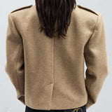 Blazer di lana con spalline e revers a lancia oversize