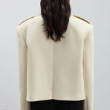 Blazer di lana con spalline e revers a lancia oversize