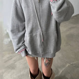 Felpa con cappuccio rosa con zip e effetto consumato