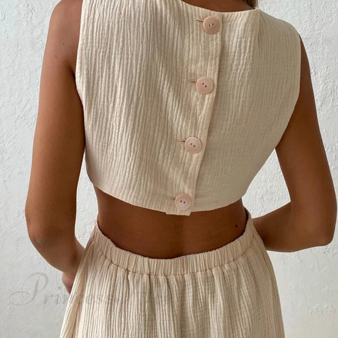 Abito canotta plissettato con chiusura monopetto e vita scoperta