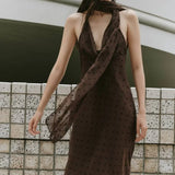 Abito lungo con collo a scialle a pois