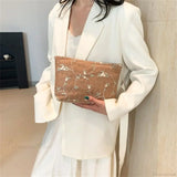 Pochette da polso in paglia di rattan