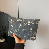 Pochette da polso in paglia di rattan