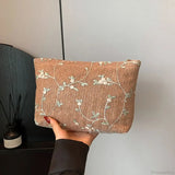 Pochette da polso in paglia di rattan