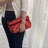 Pochette da polso in pelle con paillettes rosse