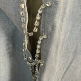 Jeans larghi a vita media con inserti a rombi e aperture laterali