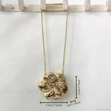 Pochette in acrilico con motivo floreale in oro rosa