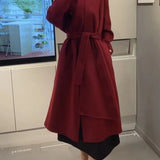 Cappotto doppiopetto in lana con collo a sciarpa