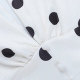 Mini abito aderente sexy con scollo a V, maniche a lanterna e cintura in vita