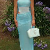 Abito lungo da festa aderente senza spalline luccicante