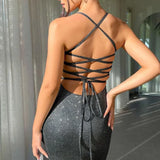 Abito da festa con cintura e schiena scoperta e luccicante