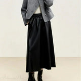 Cappotto corto monopetto in lana con scollo rotondo