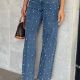 Jeans a gamba dritta sfilacciati con perline incrociate e vita inclinata