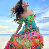 Completo due pezzi con gonna stampata con volant