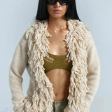 Cardigan lungo e largo in maglia con frange in tinta unita