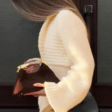 Cardigan in maglia con vita stretta e pannelli in tinta unita