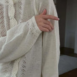 Cardigan girocollo in maglia con pizzo ritagliato