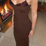 Abito lungo aderente con scollo a V e paillettes