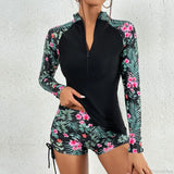 Completo due pezzi da surf sportivo con pantaloncini e rash