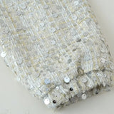 Giacca a maniche lunghe con paillettes e collo alto