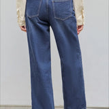 Jeans dritti e rilassati con bottoni asimmetrici