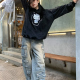 Pantaloni cargo con tasche patchwork in denim da strada