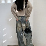 Pantaloni cargo con tasche patchwork in denim da strada